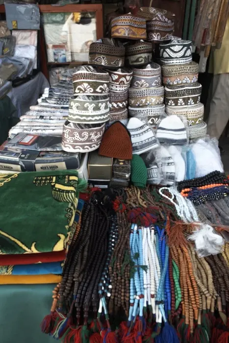 Framed Print : Islamic items including prayer mats and Muslim caps on sale at the market in the European Quarter of Djibouti City Framed Print : Islamic items including prayer mats and Muslim caps on sale at the market in the European Quarter of Djibouti City