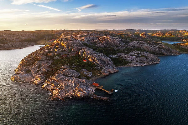 Isolated cottages on rocky granite island off the Bohuslan coast, sunset aerial view, Bohuslan, Vastra Gotaland, West Sweden, Sweden, Scandinavia, Europe