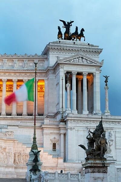 Italian flag in front of the Victor Emmanuel Monument at night, Rome, Lazio, Italy, Europe