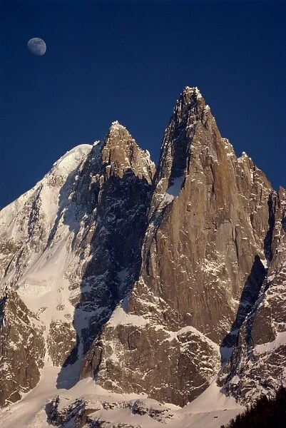 Jagged peak of Aiguille du Dru and the moon