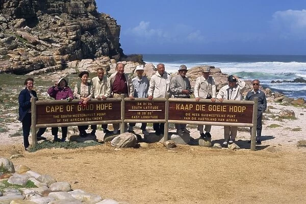 Japanese tourists behind sign at the Cape of Good Hope Nature Reserve