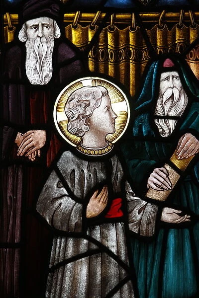 Jesus as a child in the temple with Mary and Joseph, 19th century stained glass in St