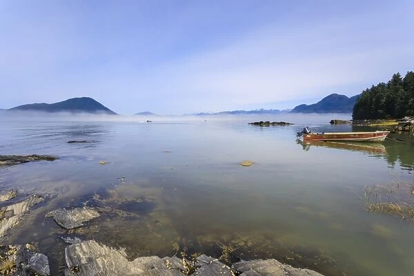 Jet-boats head for the Stikine River, mist clears from beautiful Petroglyph Beach