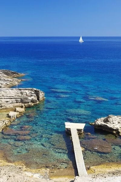 Jetty on the beach and boat, Rhodes, Dodecanese, Greek Islands, Greece, Europe