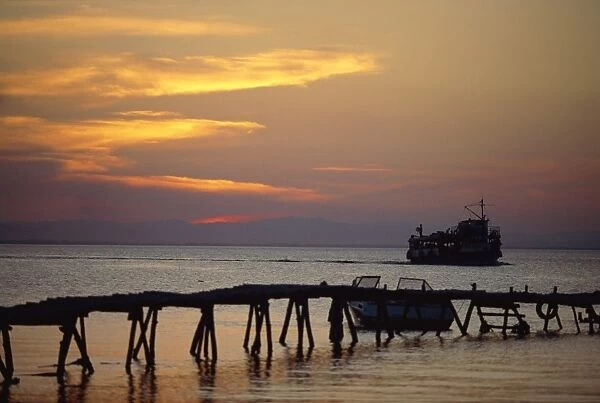 Jetty and ferry at sunset at Moyogalpa in the west of Omotepe Island, Lake Nicaragua