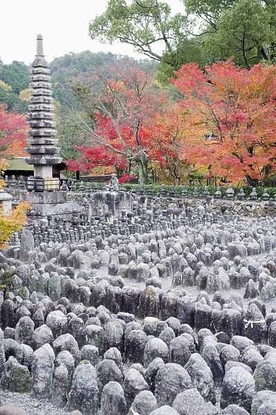 Jizo stone statues and autumn maple leaves at Adashino Nenbutsu dera temple