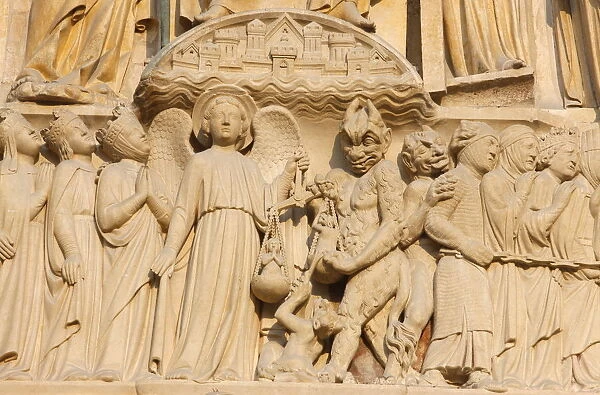 Last Judgment gate tympanum showing the angel St. Michael weighing souls, west front