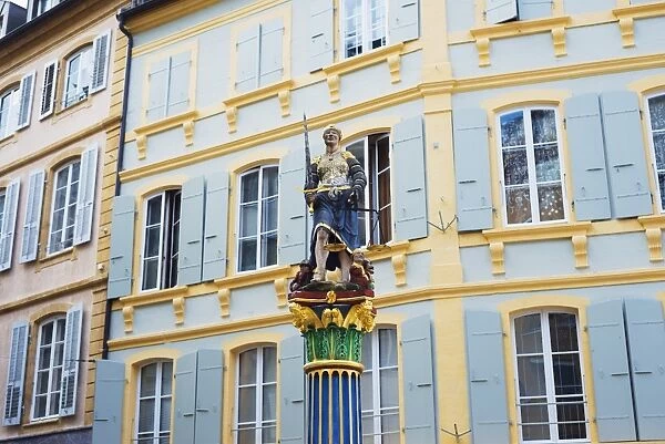 Justice statue in medieval old town square, Neuchatel, Switzerland, Europe