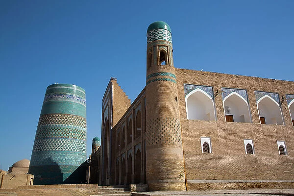 Kalta Minaret on left, Muhammad Amin Khan Madrasah (Orient Star Hotel) on the right, Ichon Qala (Itchan Kala), UNESCO World Heritage Site, Khiva, Uzbekistan, Central Asia, Asia