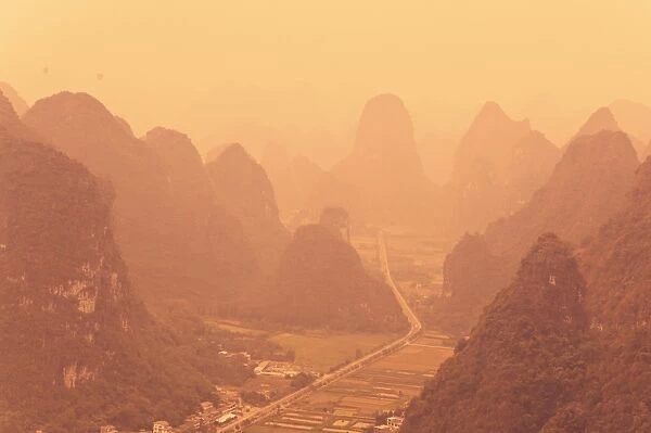 Karst landscape and morning haze, Yangshuo, Guangxi Province, China, Asia