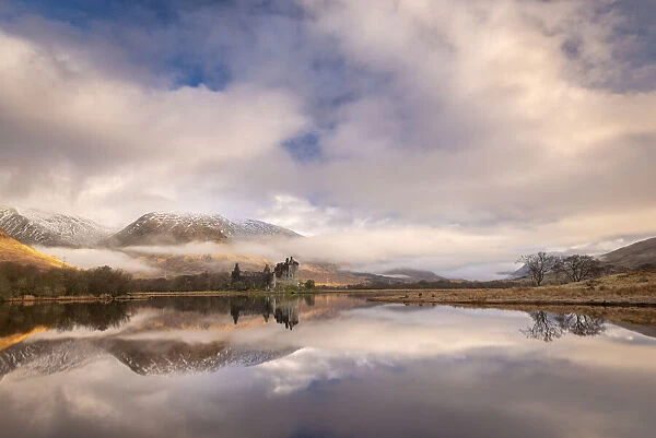 Kilchurn Castle reflected in Loch Awe at dawn in winter, Highlands, Scotland