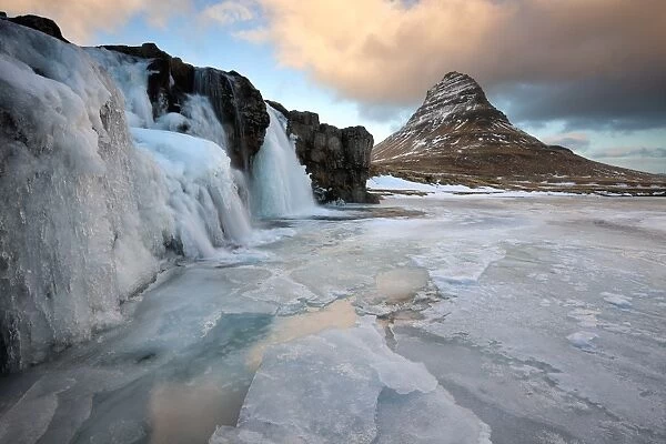 Kirkjufell (Church Mountain) in winter, with frozen waterfall, near Grundafjordur