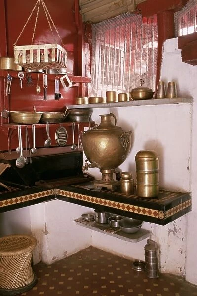Kitchen area with traditional brass cooking utensils