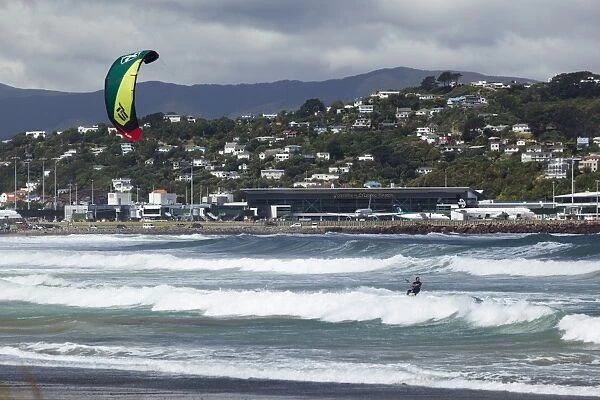 Kite surfer with airport in background, Lyall Bay, Wellington, North Island, New Zealand, Pacific