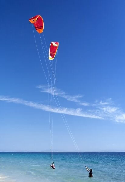 Two kiteboarders trying to take off