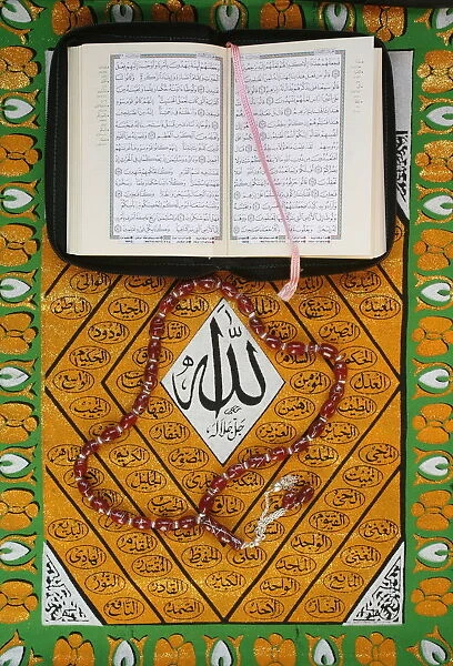 Koran, rosary and Allah calligraphy, Paris, France, Europe