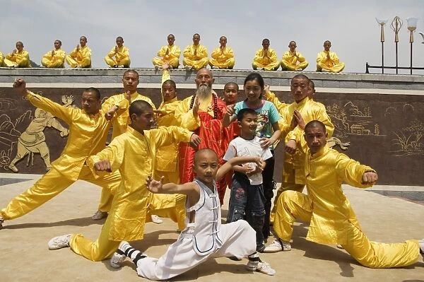 Kung fu students displaying their skills at a tourist show within Shaolin Temple