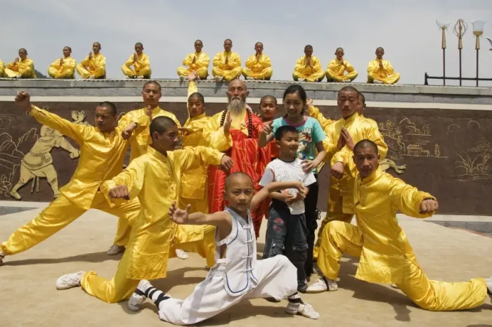 Framed Print : Kung fu students displaying their skills at a tourist show within Shaolin Temple Framed Print : Kung fu students displaying their skills at a tourist show within Shaolin Temple