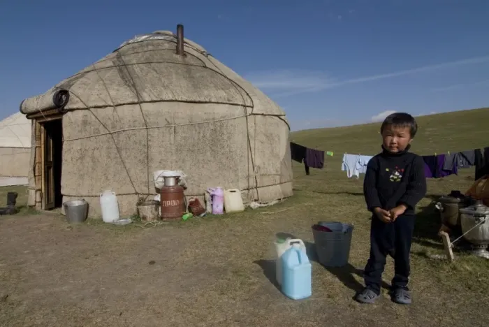Framed Print : Kyrgyz boy in front of a yurt at Song Kol, Kyrgyzstan, Central Asia, Asia Framed Print : Kyrgyz boy in front of a yurt at Song Kol, Kyrgyzstan, Central Asia, Asia