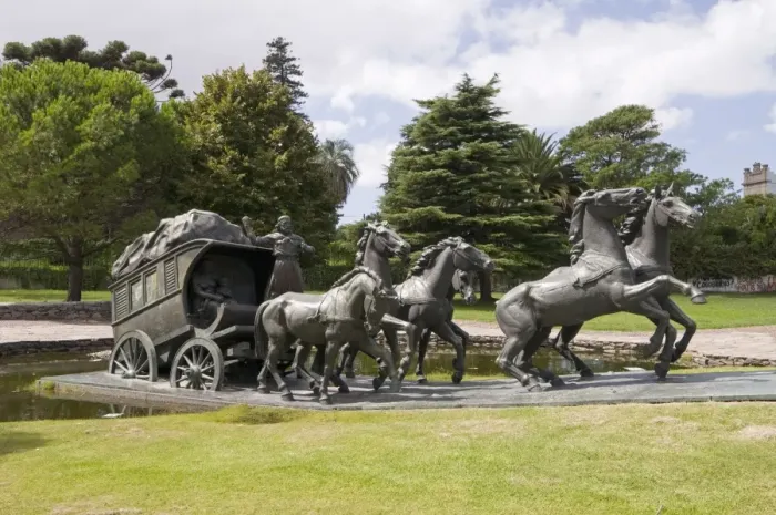 Framed Print : La Diligencia by Jose Belloni, a bronze statue of a stage coach and horses