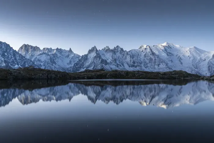 Framed Print : Lacs des Cheserys lake and peaks of Mont Blanc massif covered with snow at night Framed Print : Lacs des Cheserys lake and peaks of Mont Blanc massif covered with snow at night