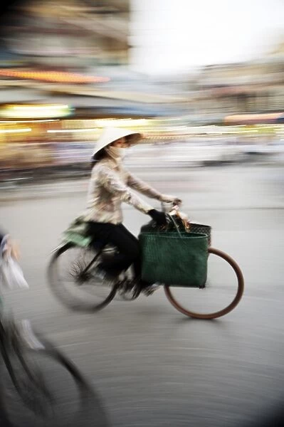 Lady on bicycle with shopping, Hanoi, Vietnam, Indochina, Southeast Asia, Asia