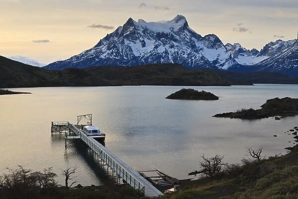 Lago Pehoe boat and dock with the Cordillera del Paine at sunset, Torres del Paine National Park, Patagonia, Chile, South America