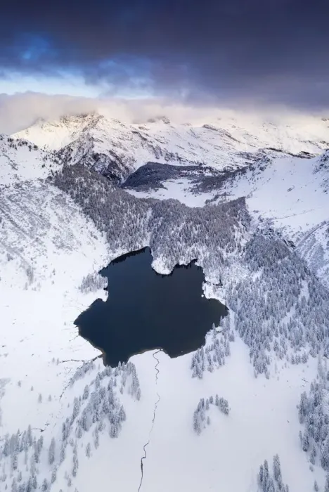 Framed Print : Lake Cavloc surrounded by snow, aerial view, Bregaglia Valley, Engadine Framed Print : Lake Cavloc surrounded by snow, aerial view, Bregaglia Valley, Engadine