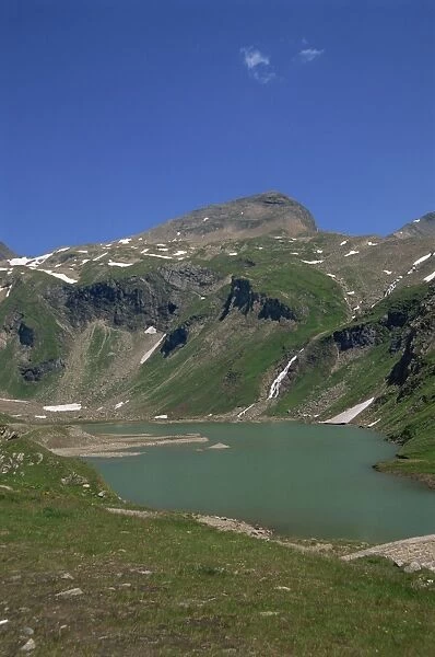Lake and waterfall in the Hohe Tauern National Park, Austrian Alps, Austria, Europe