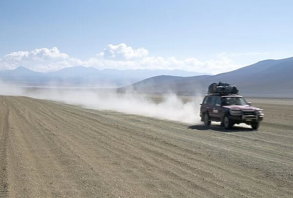 Land cruiser on altiplano track with tourists going to Laguna Colorado