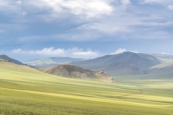 Landscape of the green Mongolian steppe under a gloomy sky, Ovorkhangai province