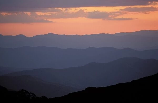 Landscape view, twilight glow and mountain ridges of High Country from Mount Feathertop