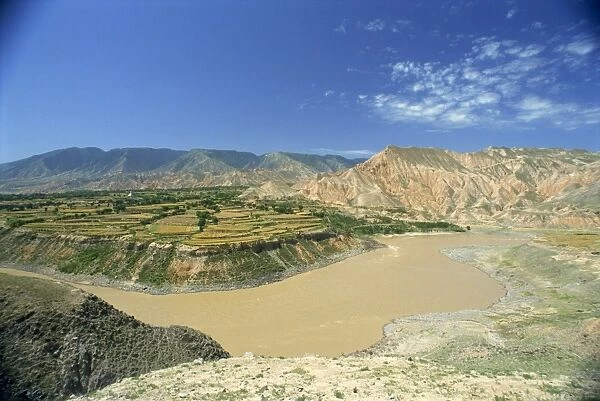 Landscape of the Yellow River, farm land and hills in Qinghai, China, Asia