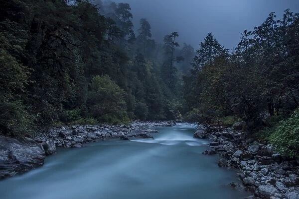 Langtang Khola near the little village of Riverside on a misty evening in the Langtang