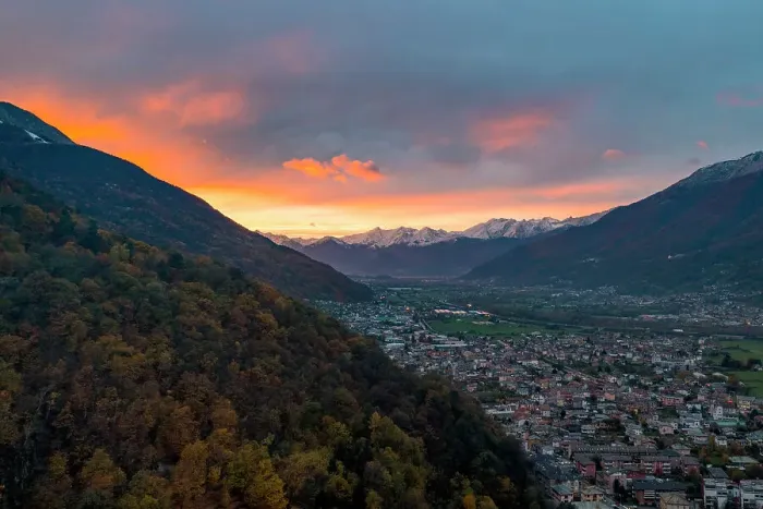 Framed Print : Larch tree woods on mountains surrounding Morbegno town at sunset in autumn, Valtellina, Sondrio province, Lombardy, Italy, Europe Framed Print : Larch tree woods on mountains surrounding Morbegno town at sunset in autumn, Valtellina, Sondrio province, Lombardy, Italy, Europe