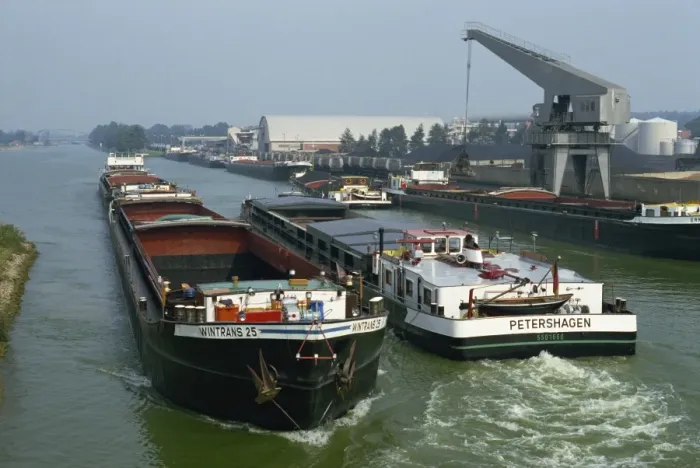 Framed Print : Large barges pass on busy canal near the Netherlands border Framed Print : Large barges pass on busy canal near the Netherlands border