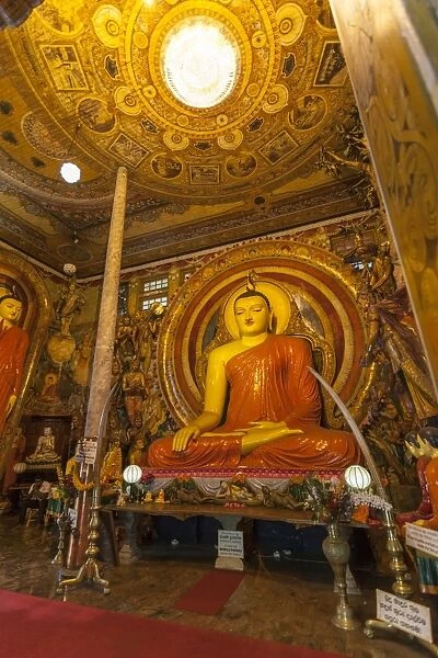 Large Buddhist statue at Gangaramaya Temple, Colombo, Sri Lanka, Asia