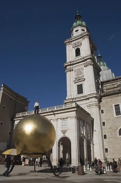 Large golden ball in Kapitelplatz, Salzburg, Austria, Europe