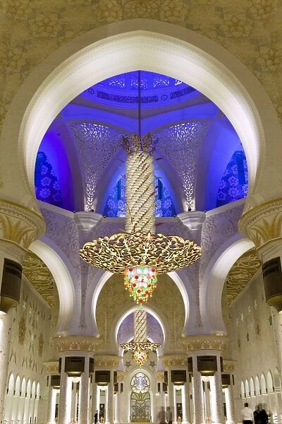 The largest ornate chandelier in the world hanging from the main dome inside the prayer hall of Sheikh Zayed Bin Sultan Al Nahyan Mosque, Abu Dhabi, United Arab Emirates