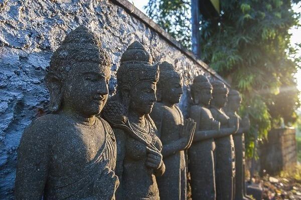 Late afternoon light on stone statues in the Pura Besakih temple complex, Bali, Indonesia, Southeast Asia, Asia