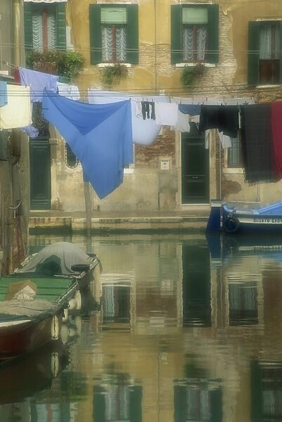 Laundry hung over canal to dry