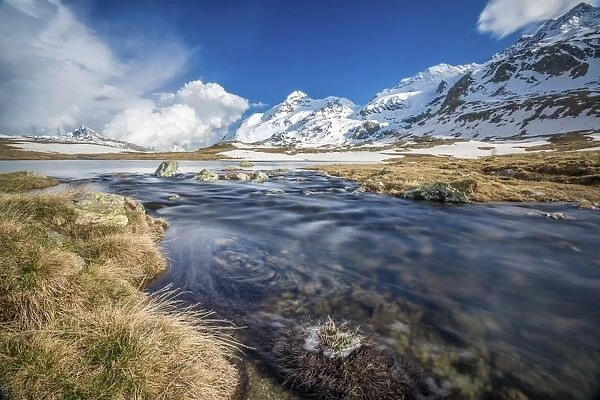 Lej Pitschen surrounded by snow capped mountains, Bernina Pass, Engadine, Canton of Graubunden