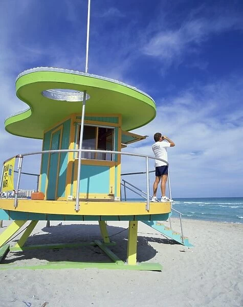Lifeguards hut with man looking out to sea with binoculars, South Beach