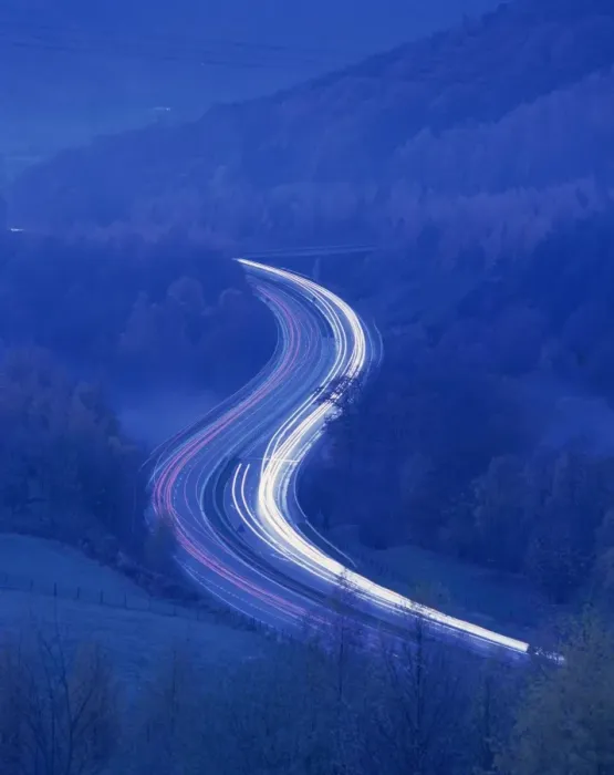 Framed Print : Light trails on rural road at twilight through woods in the Lake District Framed Print : Light trails on rural road at twilight through woods in the Lake District