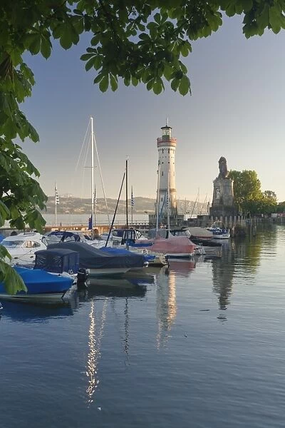 Lighthouse and Bavarian Lion at the port at sunset, Lindau, Lake Constance, Bavaria