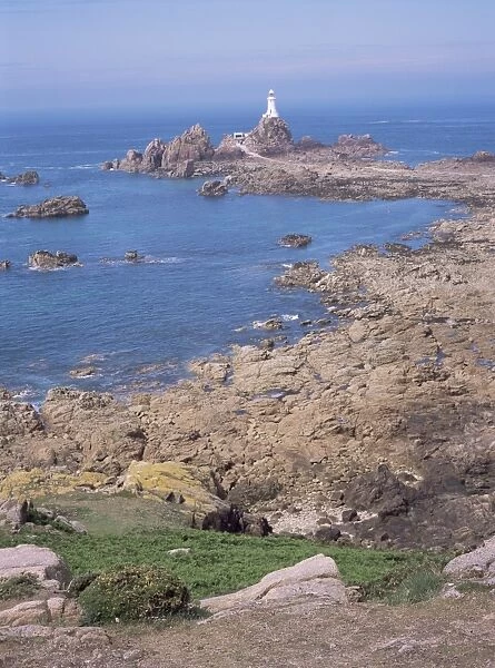 Lighthouse from cliffs at low tide, Corbiere, St. Brelade, Jersey, Channel Islands