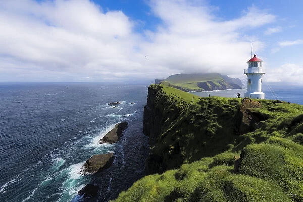 Lighthouse on islet known as Mykines Holmur, Mykines Island, Faroe Islands, Denmark