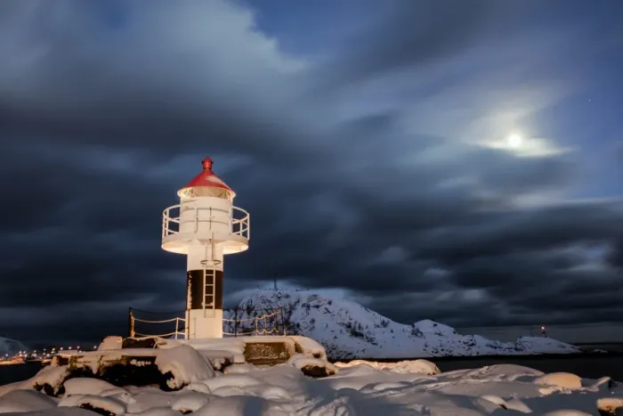 Framed Print : Lighthouse and full moon in the Arctic night with the village of Reine in the background Framed Print : Lighthouse and full moon in the Arctic night with the village of Reine in the background