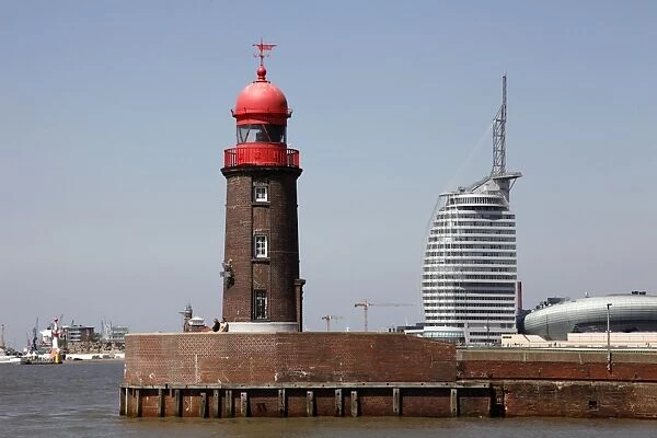 Lighthouse at old harbour, and Atlantic Hotel Sail City, Bremerhaven, Bremen