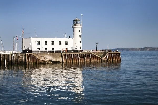 The Lighthouse reflected in the Harbour, Scarborough, North Yorkshire, Yorkshire, England, United Kingdom, Europe